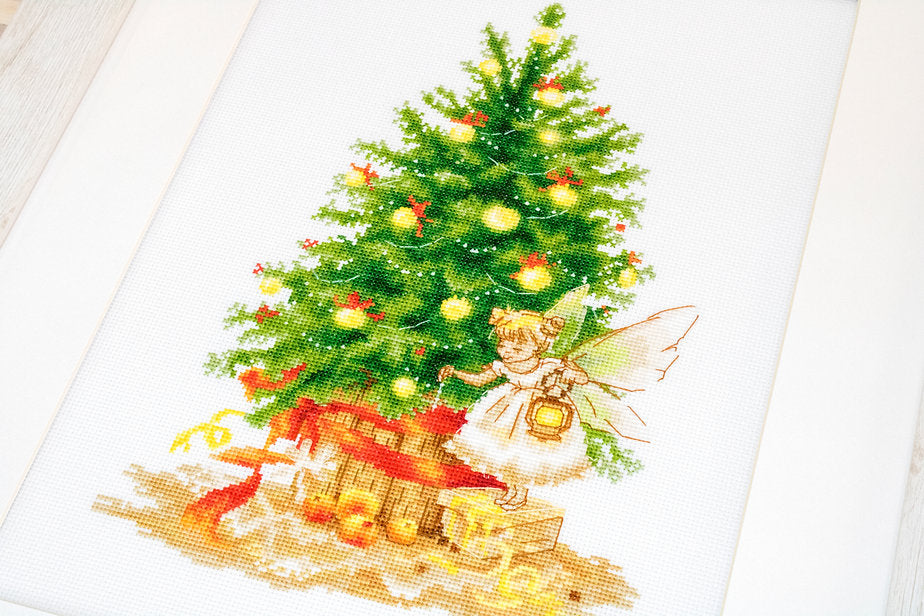 Christmas Tree B1117L Counted Cross-Stitch Kit featuring Aida canvas, colorful threads, and needle for holiday crafting.